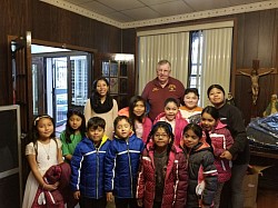 We give coats to kids in need