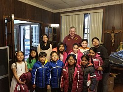 We give coats to kids in need